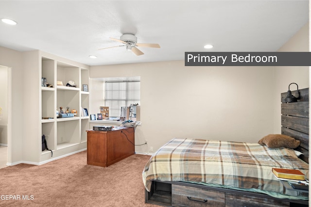 bedroom featuring ceiling fan and light carpet