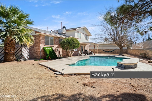 view of pool with a patio area and central AC