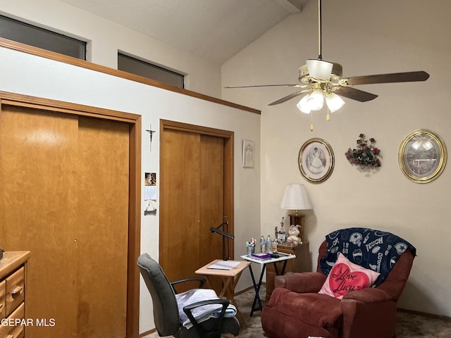 living area featuring lofted ceiling and ceiling fan