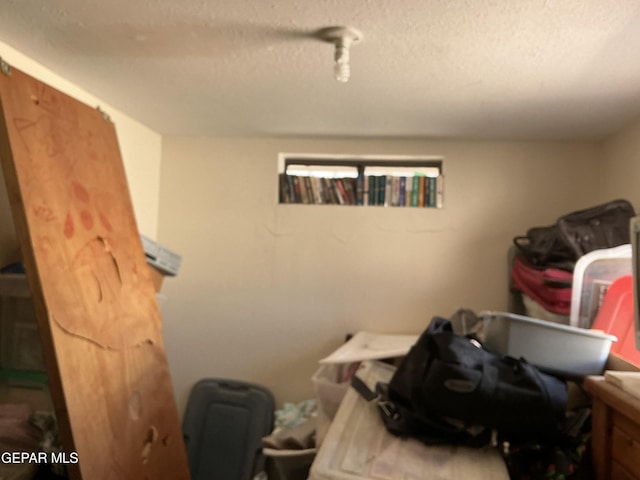 washroom with a textured ceiling