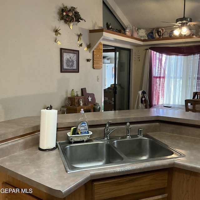 kitchen with ceiling fan and sink