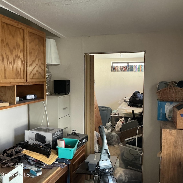 miscellaneous room with a textured ceiling