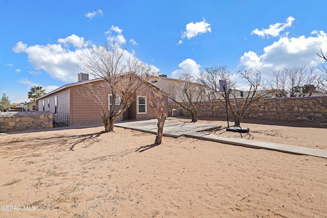 back of house featuring central air condition unit and a patio