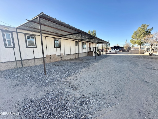 exterior space with a carport