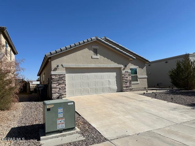 single story home with a garage