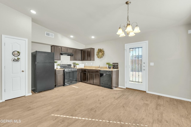 kitchen featuring black appliances, hanging light fixtures, dark brown cabinets, light hardwood / wood-style flooring, and lofted ceiling