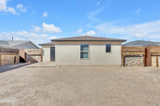 back of property with a patio area