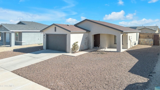 ranch-style home featuring a garage