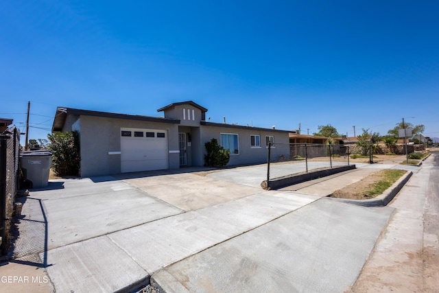 678 Lomaland Dr, El Paso, TX 79907 - single story home with a garage, stucco siding, and concrete driveway