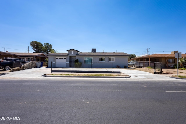 678 Lomaland Dr, El Paso, TX 79907 - ranch-style home featuring concrete driveway, a garage, and stucco siding