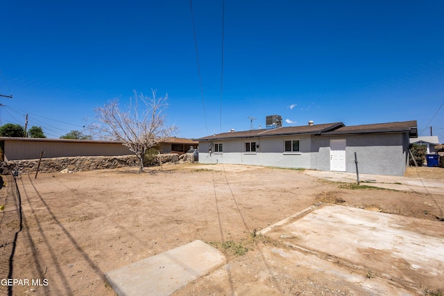 678 Lomaland Dr, El Paso, TX 79907 - rear view of property featuring stucco siding