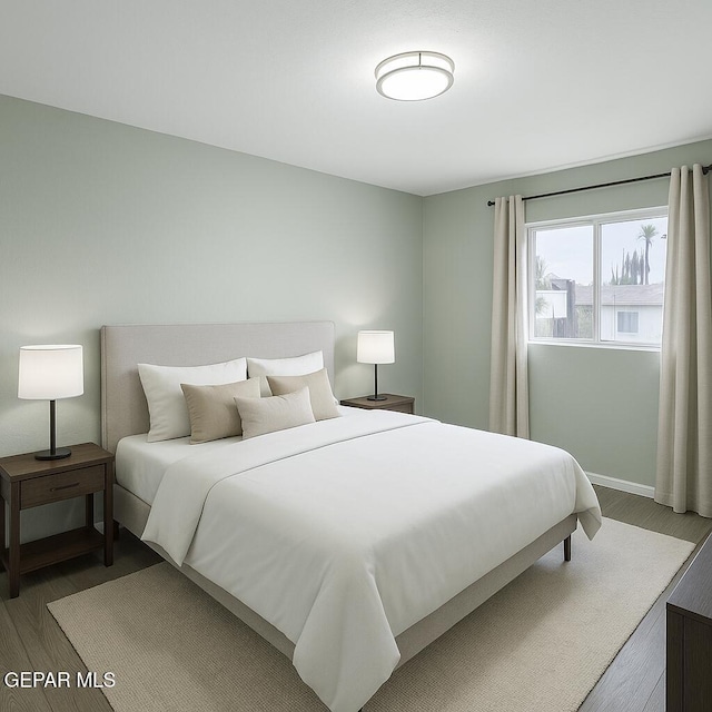 678 Lomaland Dr, El Paso, TX 79907 - bedroom featuring wood finished floors and baseboards