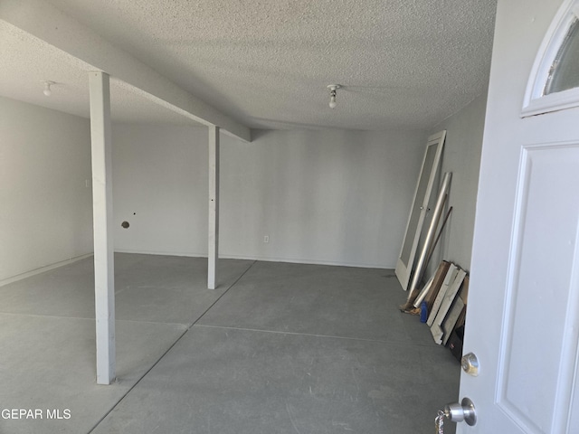 basement with a textured ceiling