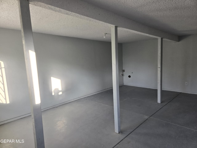 basement with a textured ceiling