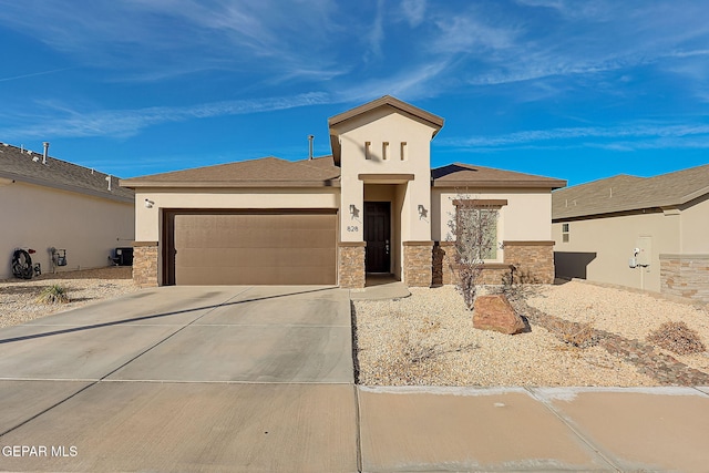 prairie-style home featuring a garage