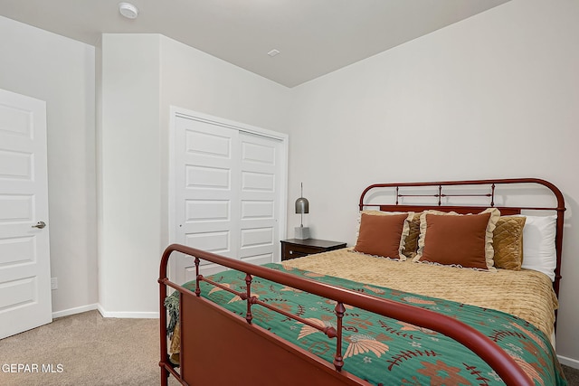 bedroom with a closet and carpet flooring