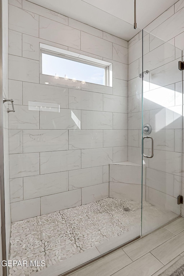 bathroom with an enclosed shower