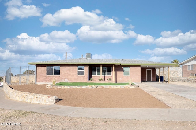 view of front of property featuring a carport