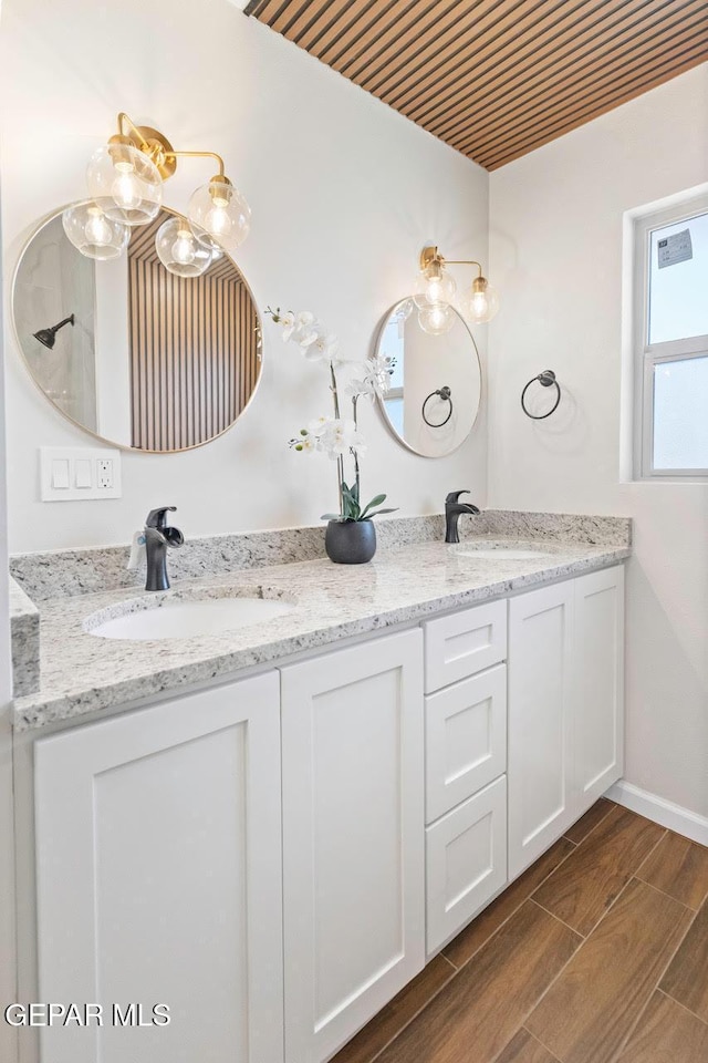 bathroom with wood ceiling and vanity