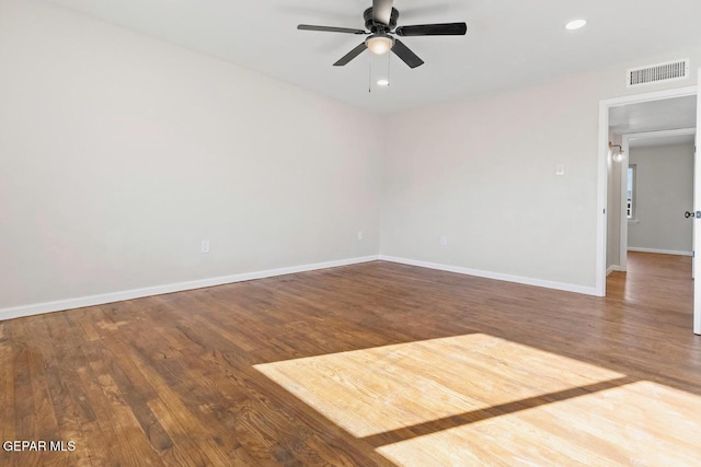 unfurnished room with ceiling fan and hardwood / wood-style flooring