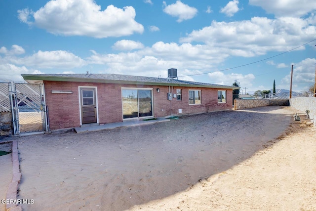 rear view of property featuring central air condition unit