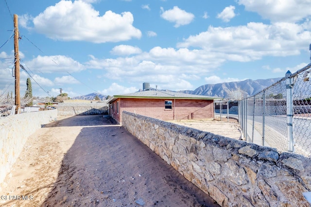 view of side of home featuring a mountain view