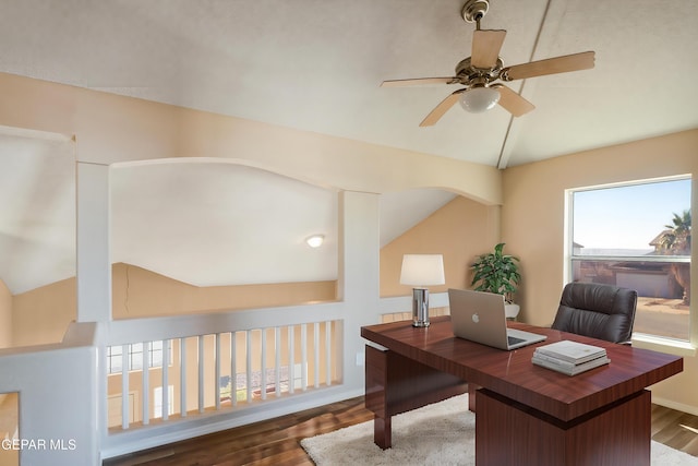 office area with vaulted ceiling, ceiling fan, and dark hardwood / wood-style flooring