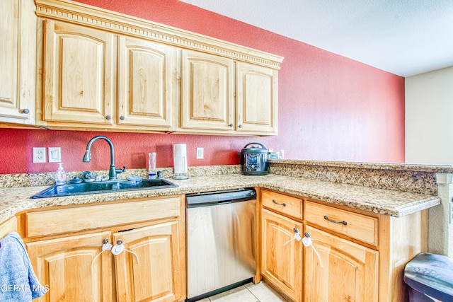 kitchen with sink, light tile patterned floors, and dishwasher