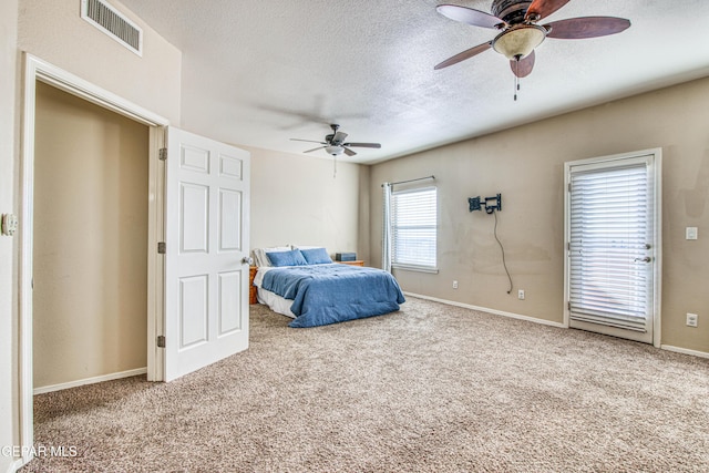 bedroom with ceiling fan and carpet flooring