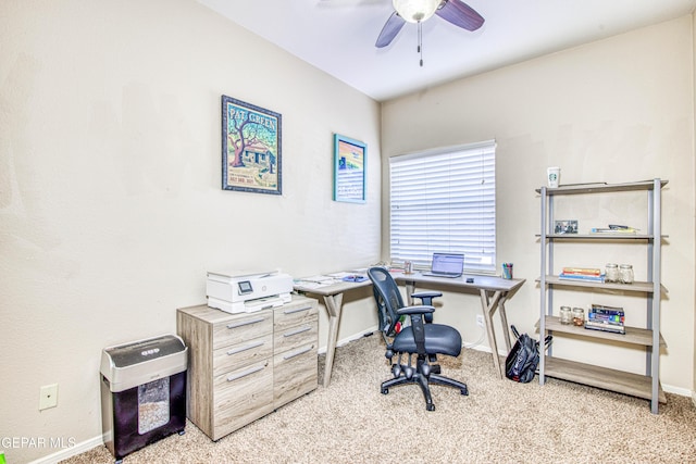 office area with ceiling fan and light carpet