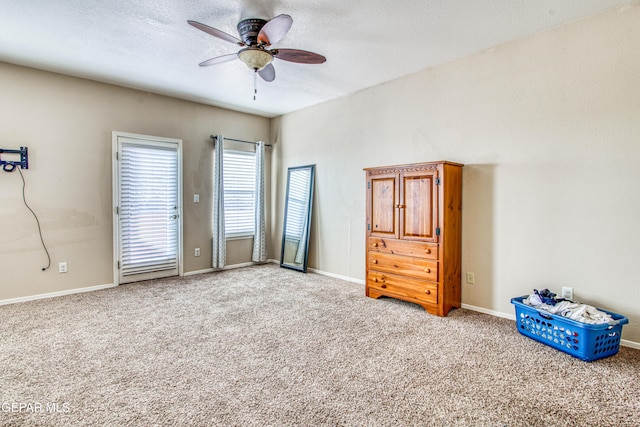 unfurnished bedroom with ceiling fan and carpet floors