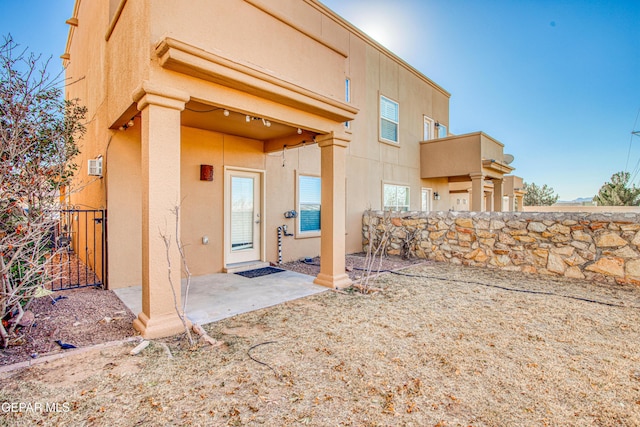 rear view of property featuring a patio