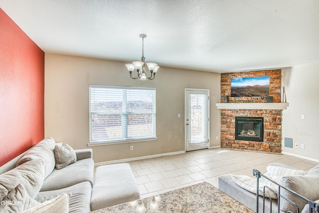 living room featuring a notable chandelier, a stone fireplace, light tile patterned floors, and a textured ceiling