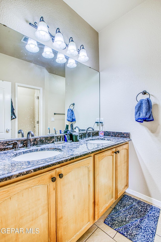 bathroom featuring vanity and tile patterned flooring