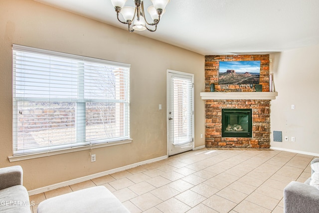 tiled living room with a fireplace and a notable chandelier