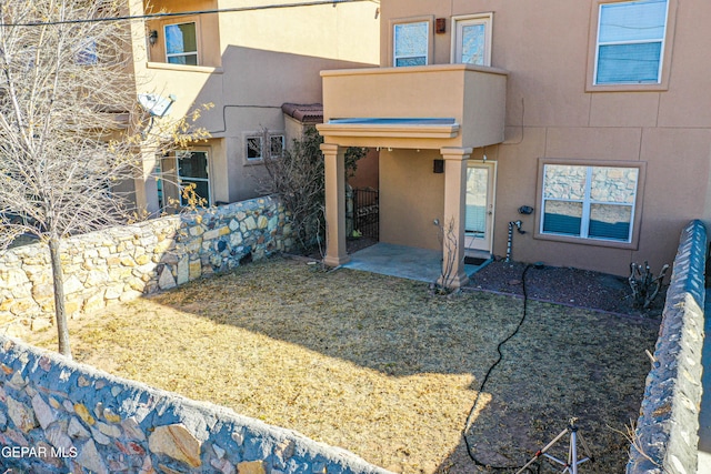 rear view of house with a patio