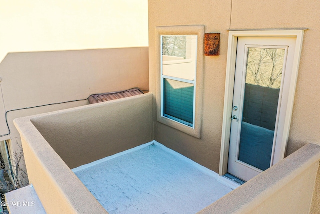 doorway to property with a balcony