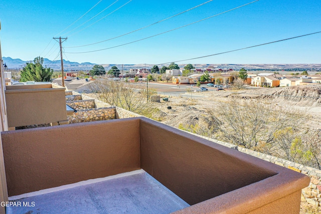 balcony featuring a mountain view