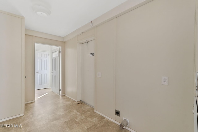 washroom with hookup for an electric dryer