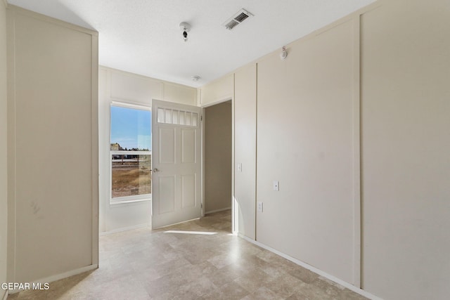 interior space featuring a textured ceiling