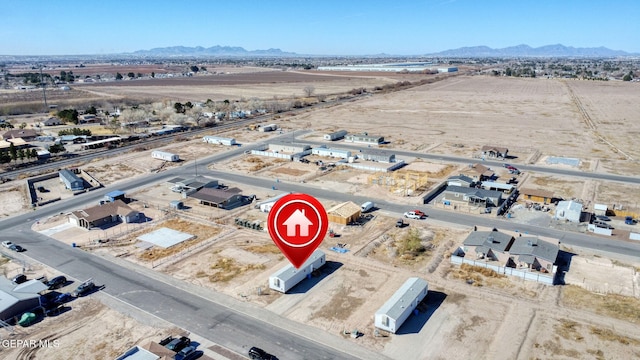 birds eye view of property featuring a mountain view