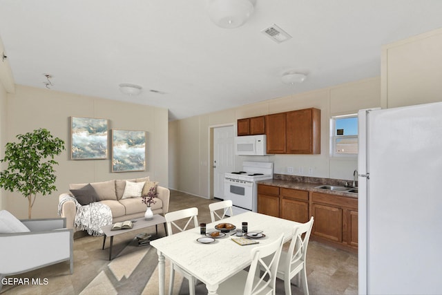 kitchen featuring sink and white appliances