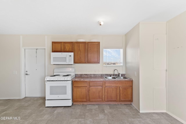 kitchen featuring sink and white appliances