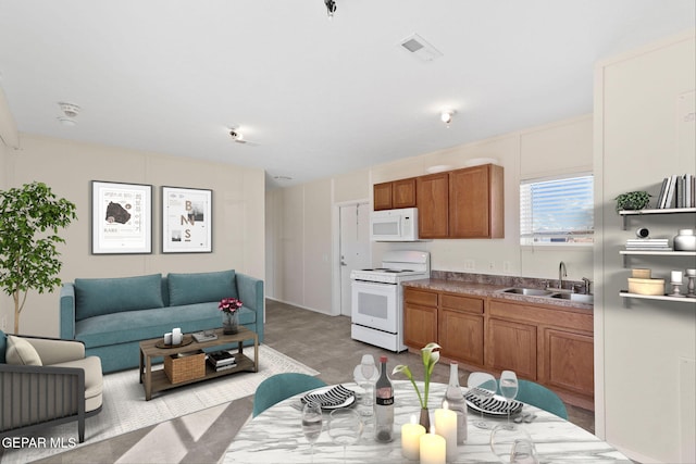 kitchen featuring sink and white appliances