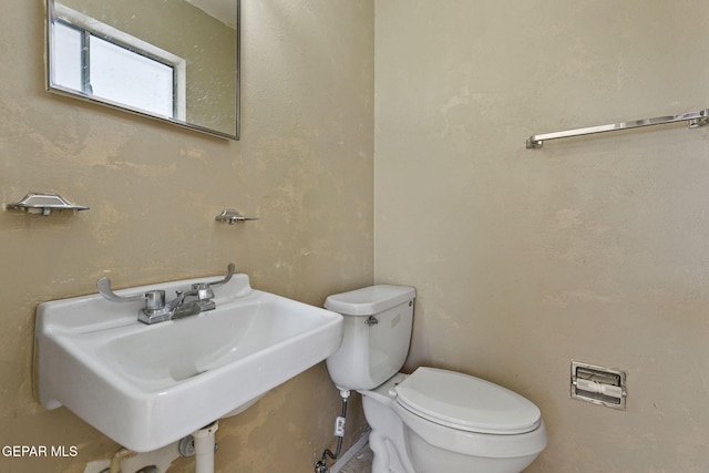 bathroom featuring sink and toilet