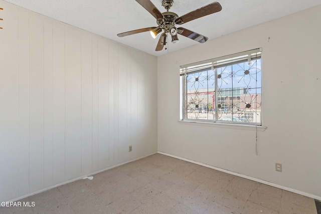 empty room featuring ceiling fan