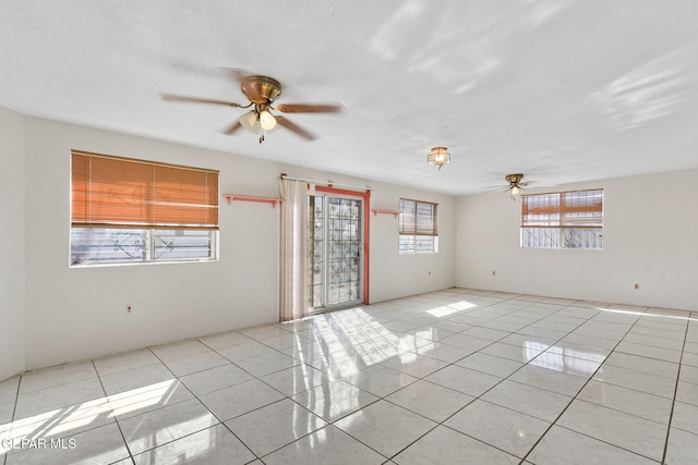 unfurnished room with ceiling fan