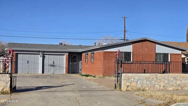 ranch-style house featuring a garage