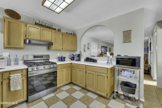 kitchen featuring light tile patterned floors and appliances with stainless steel finishes