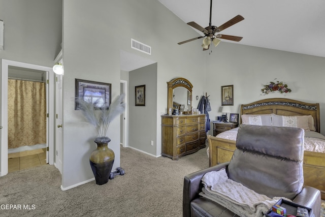 carpeted bedroom featuring ceiling fan, high vaulted ceiling, and ensuite bath